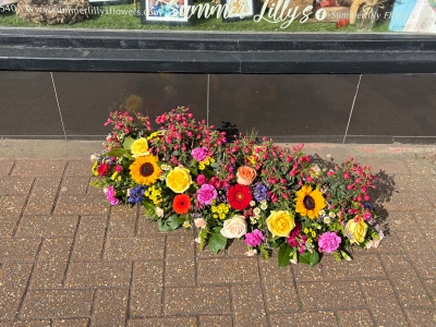 Casket spray complete with real plants to be planted in the garden after