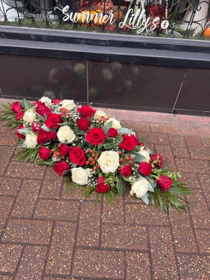 Red and white rose casket spray