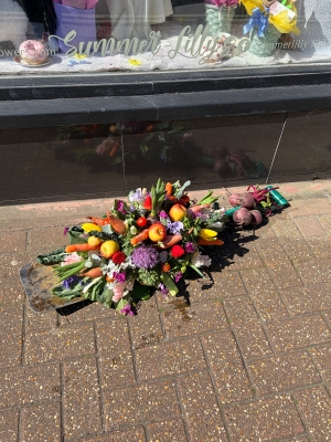 Spade with flowers and plants