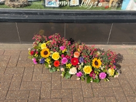 Casket spray complete with real plants to be planted in the garden after